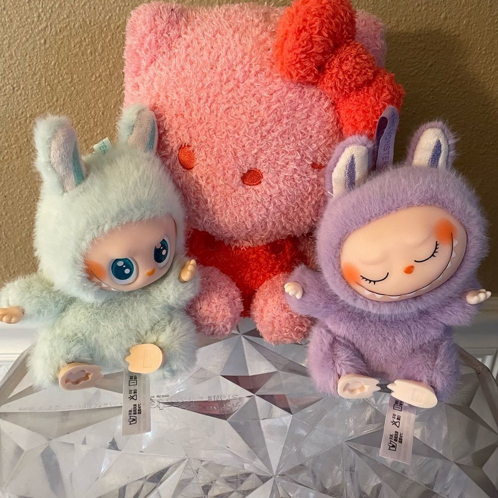 The Monsters Pop Mart Pink and Purple Figures & Pink Hello Kitty Plush